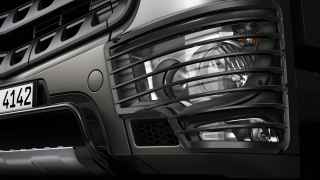 Protective headlamp grille